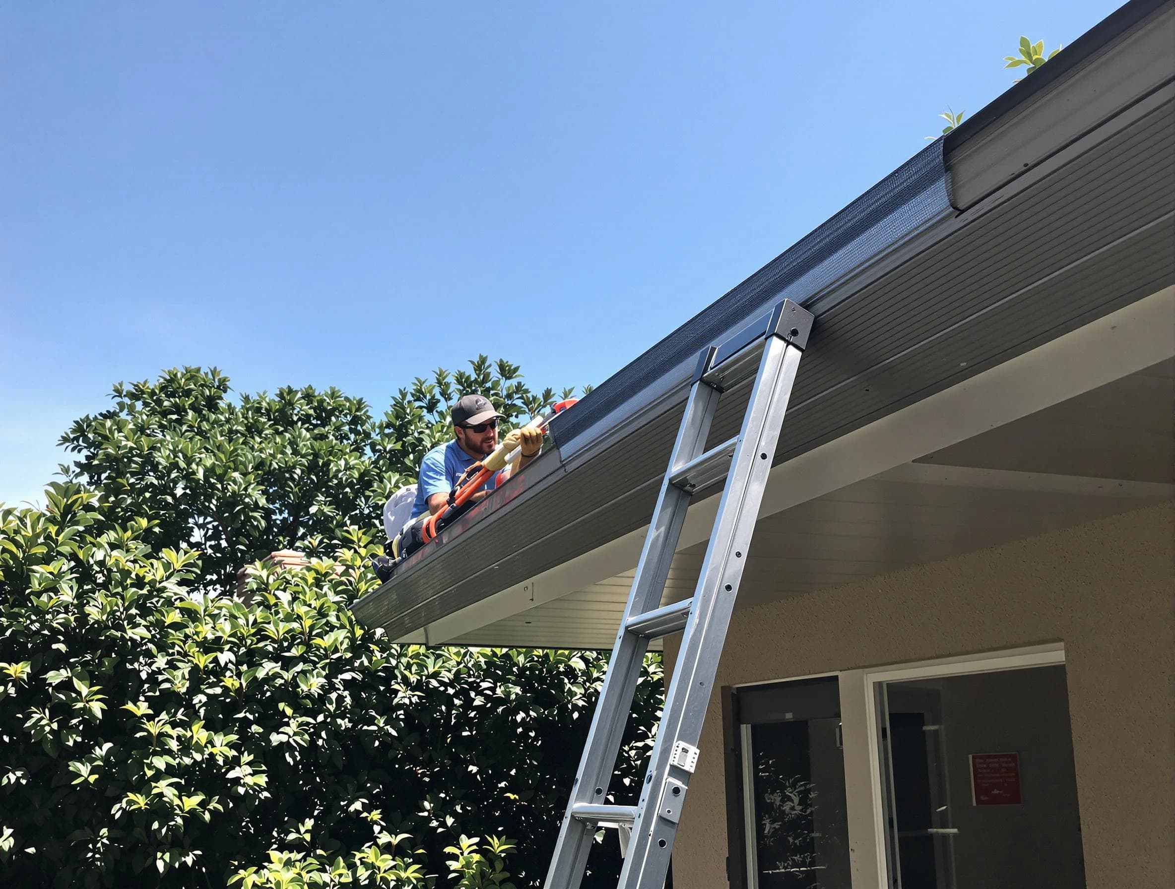 Wickliffe Roofing Company installing gutter guards for a homeowner in Wickliffe, OH